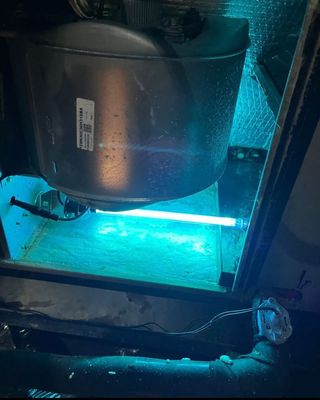 Whole-home UV light air purifier installed in residential ductwork